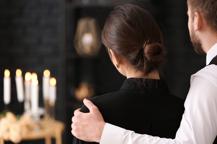 grieving couple at funeral