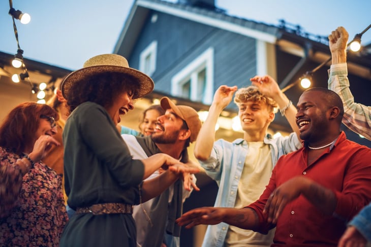 Guests dancing at an outdoor house party