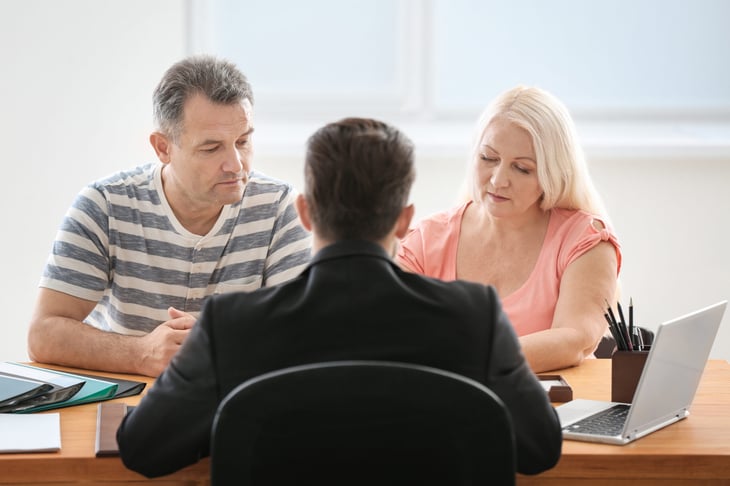 Older couple planning inheritance with a lawyer