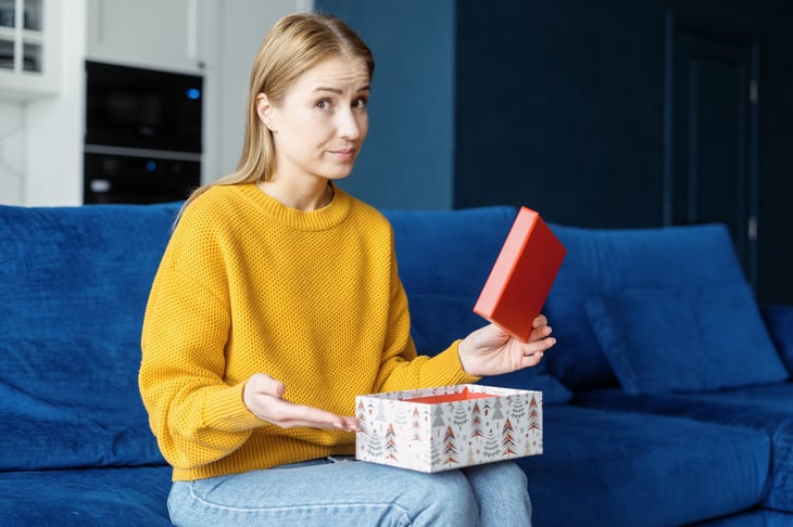 woman not thrilled with holiday gift