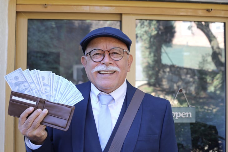 Senior man with full wallet