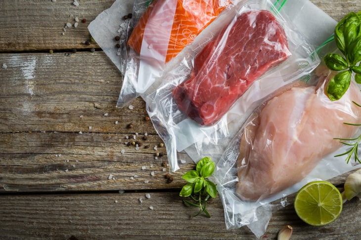 Beef, chicken and salmon in vacuum plastic bag