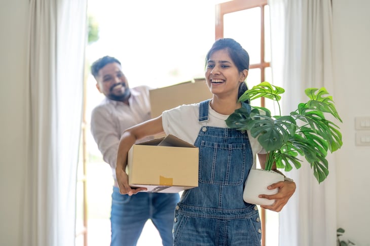 Young couple moving into new home