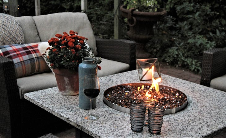 Outdoor seating arrangement around a gas fire pit table