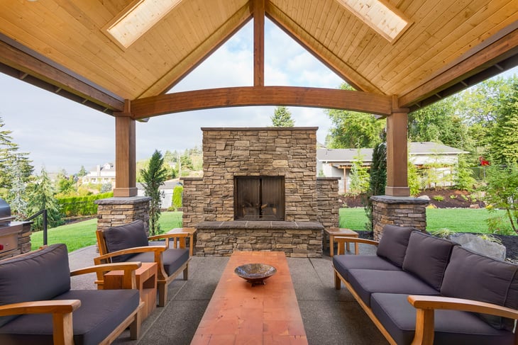 Beautiful Covered Patio Outside New Luxury Home with fireplace