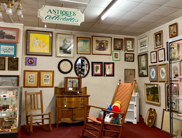 Antiques, collectibles, artwork and vintage items for sale in a thrift store.