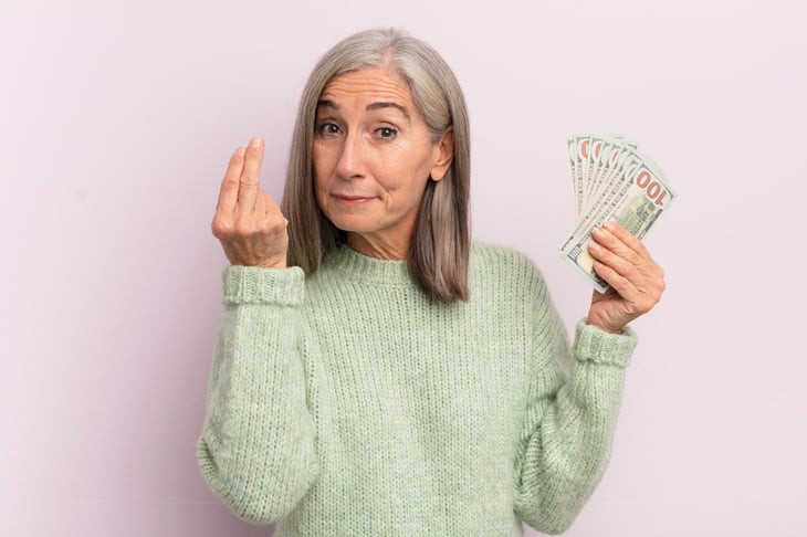 Senior woman with money