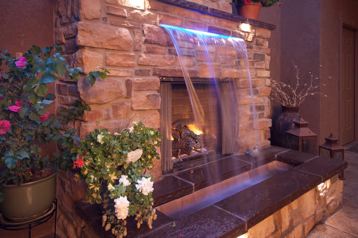 Fireplace with a waterfall over the front