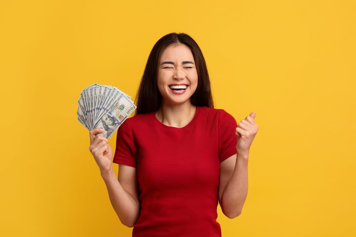 happy woman with cash