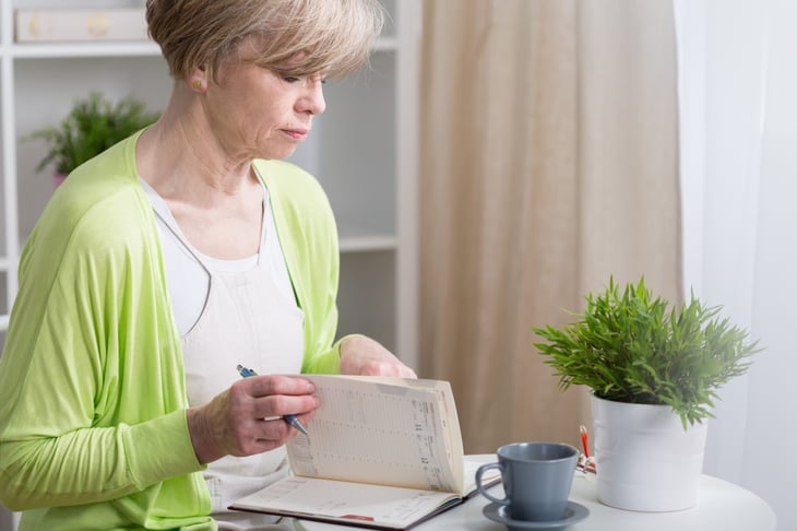 Middle-aged woman with a planner for retirement planning