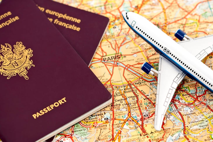 Passport of France over a map of Paris