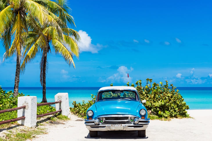 Classic car on beach in Cuba