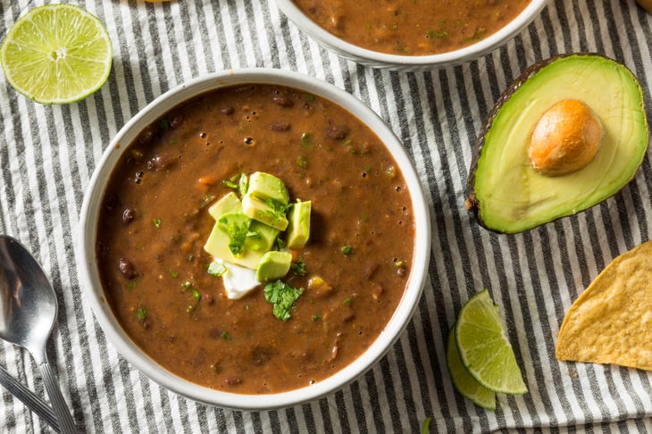 Black bean chili with avocado, lime
