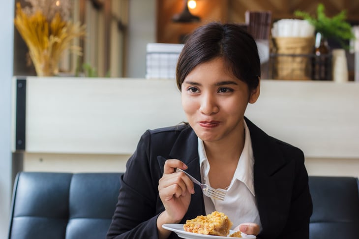 Woman eating pie