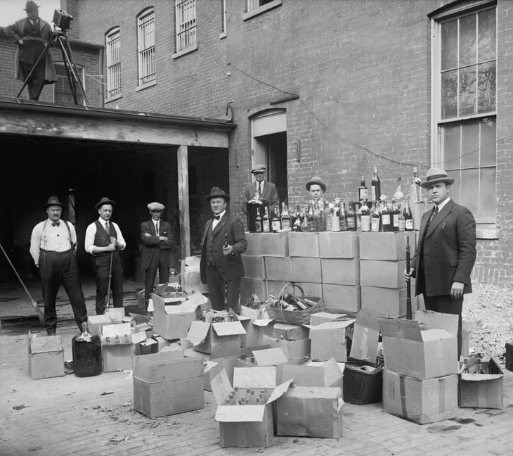 Government agents during the Prohibition era with smuggled liquor