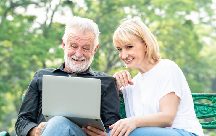 Senior couple looking at computer