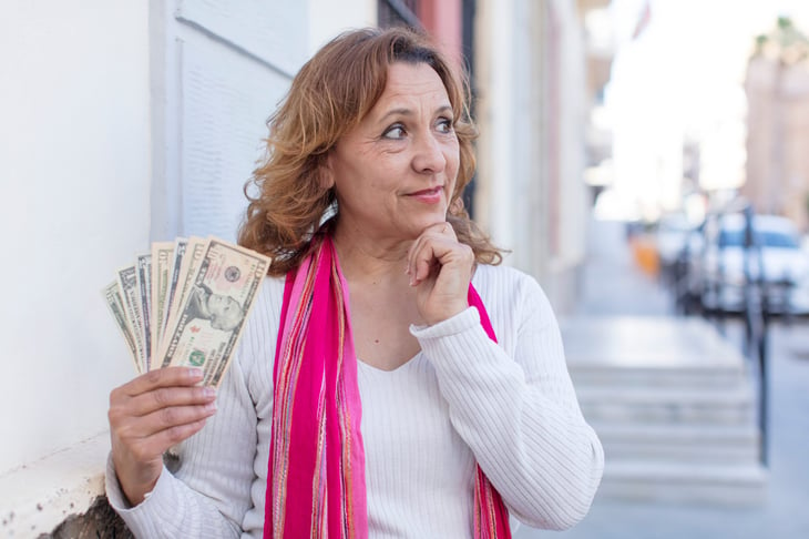 Woman thinking about what to do with her money