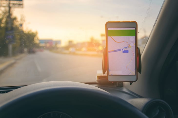 Google Maps navigating car driver on a phone