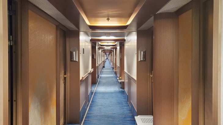 Cruise ship guest hallway with guests cabins on both sides