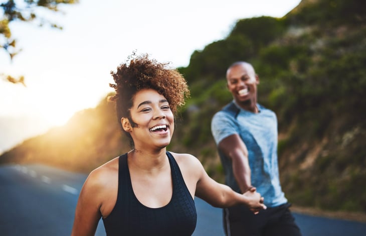 Happy young couple exercising
