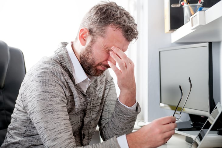 Unhappy middle-aged male worker