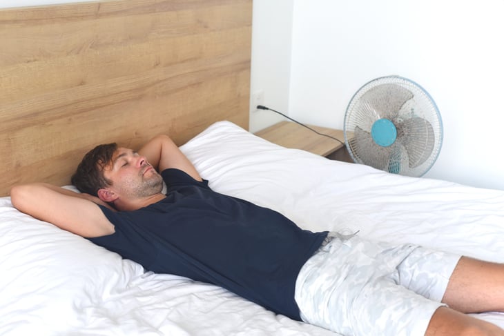 Man sleeping at home in the summer