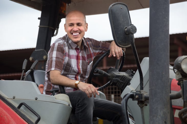 Man operating agricultural machinery