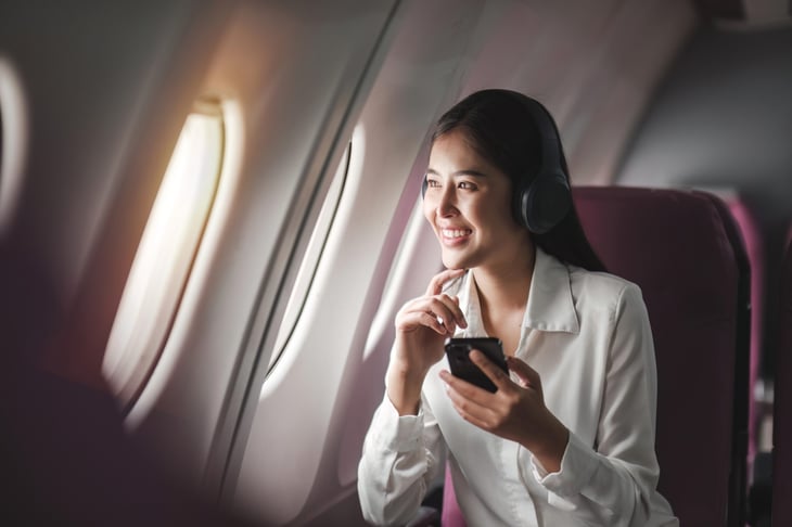 Happy woman on an airplane