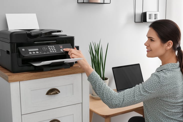 Woman using a home printer