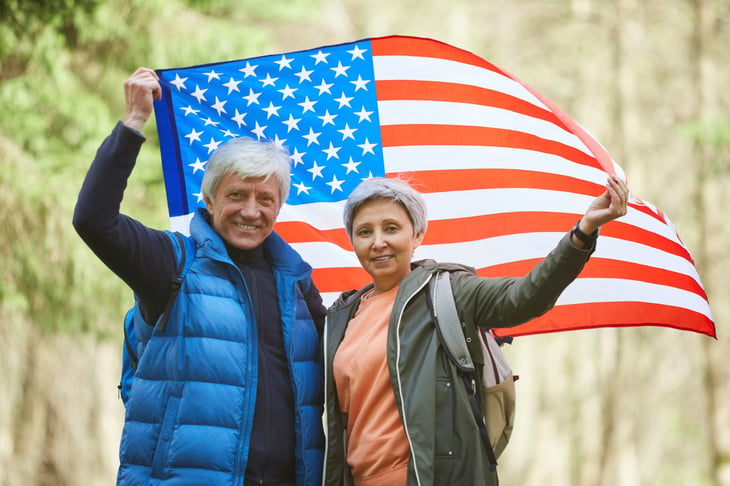 Senior couple with a U.S. flag