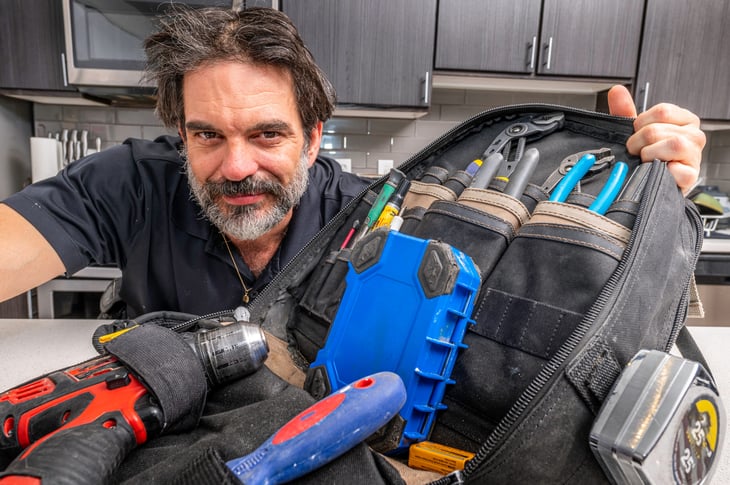 Repair man showing his DIY tools for home repair