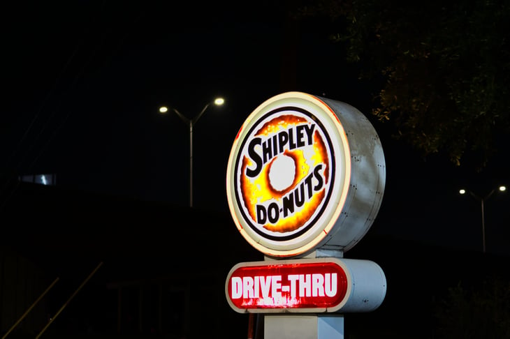 Neon Shipley Do-Nuts sign at night in Humble, TX.
