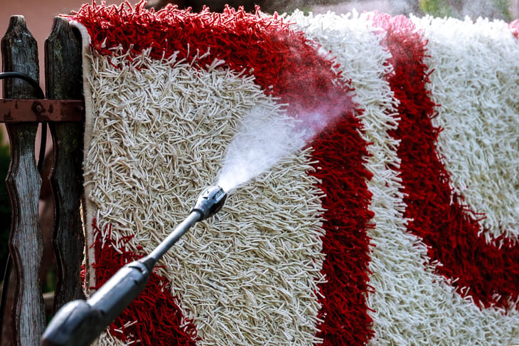 Pressure washing a rug