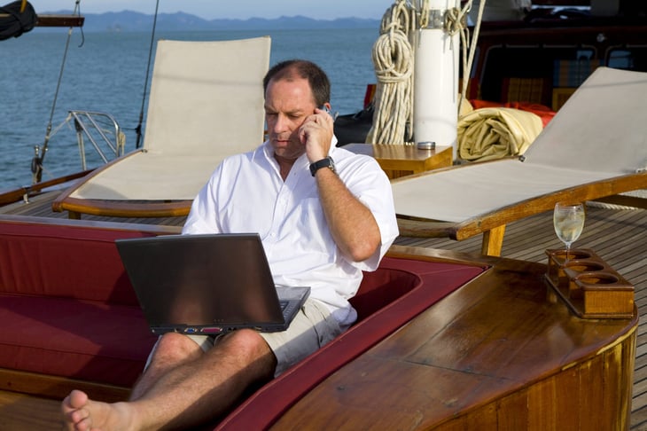 Rich person working on a yacht
