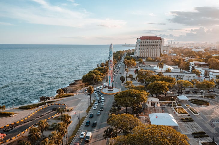 An aerial view of an obelisk during sunset in the Malecon of Santo Domingo, Dominican Republic