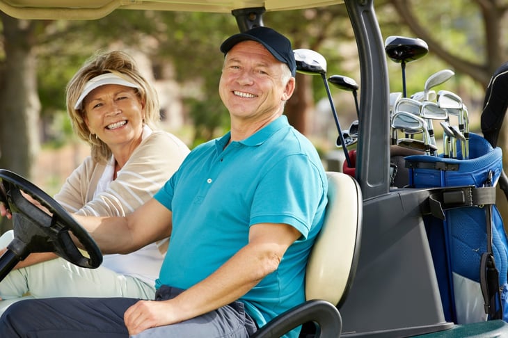 Senior couple playing golf