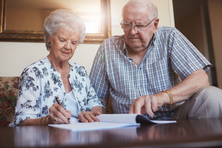 older couple writing will