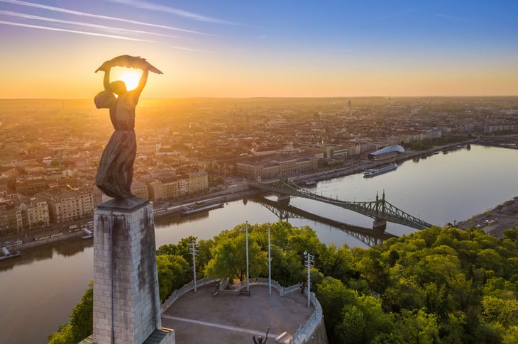 Budapest, Hungary - Aerial view of the Hungarian Statue of Liberty monument with Liberty Bridge and Budapest skyline