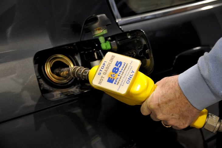 Driver fueling a car with ethanol