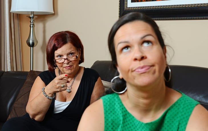 Parent pointing at an adult child