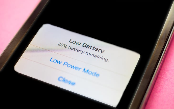 iPhone with a low battery message displayed