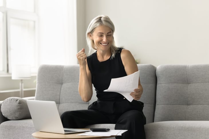 Excited woman looking at her retirement portfolio