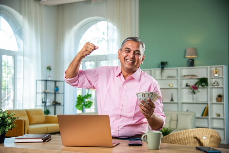 Senior man holding money