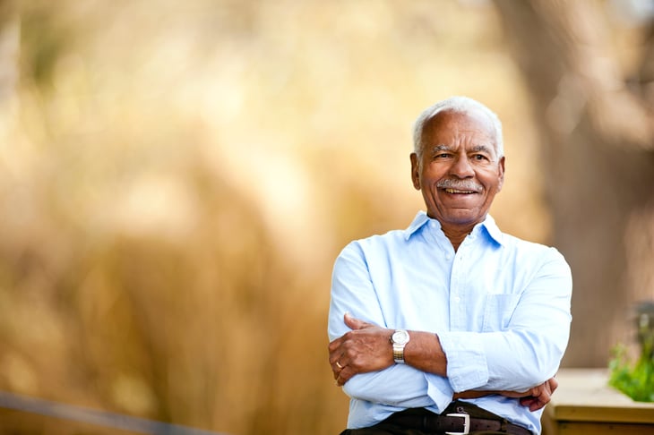 Amused happy senior man