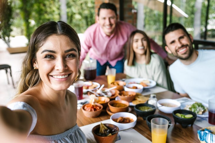 Friends taking a selfie at a restaurant