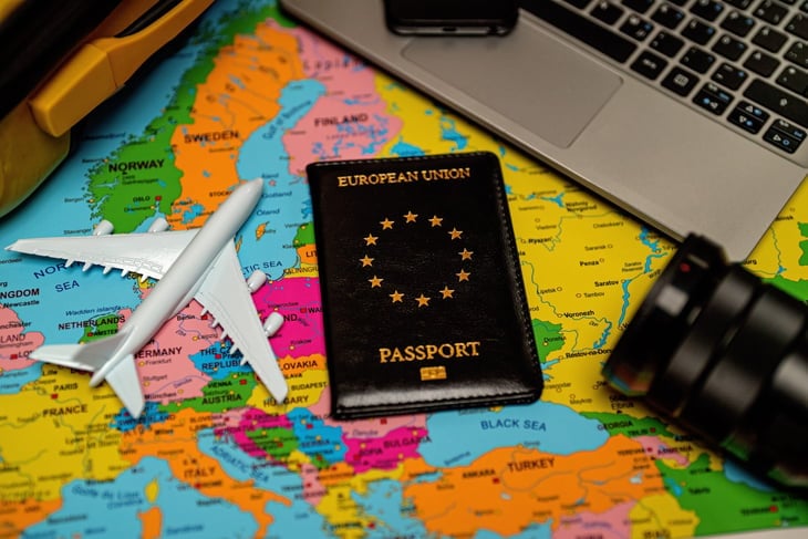 European Union passport on Europe map.