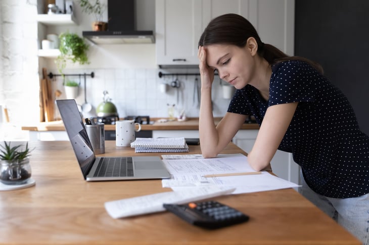 Unhappy woman stressing over bills
