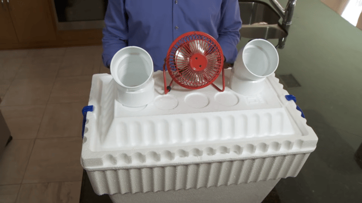 Styrofoam cooler with fan and PVC pipes for homemade DIY AC