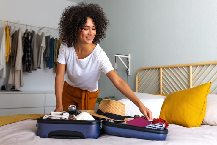 woman packing to go on vacation