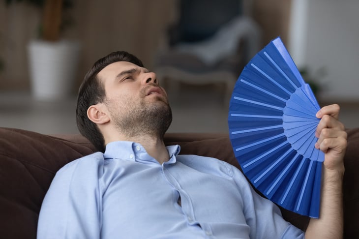 Man fanning himself